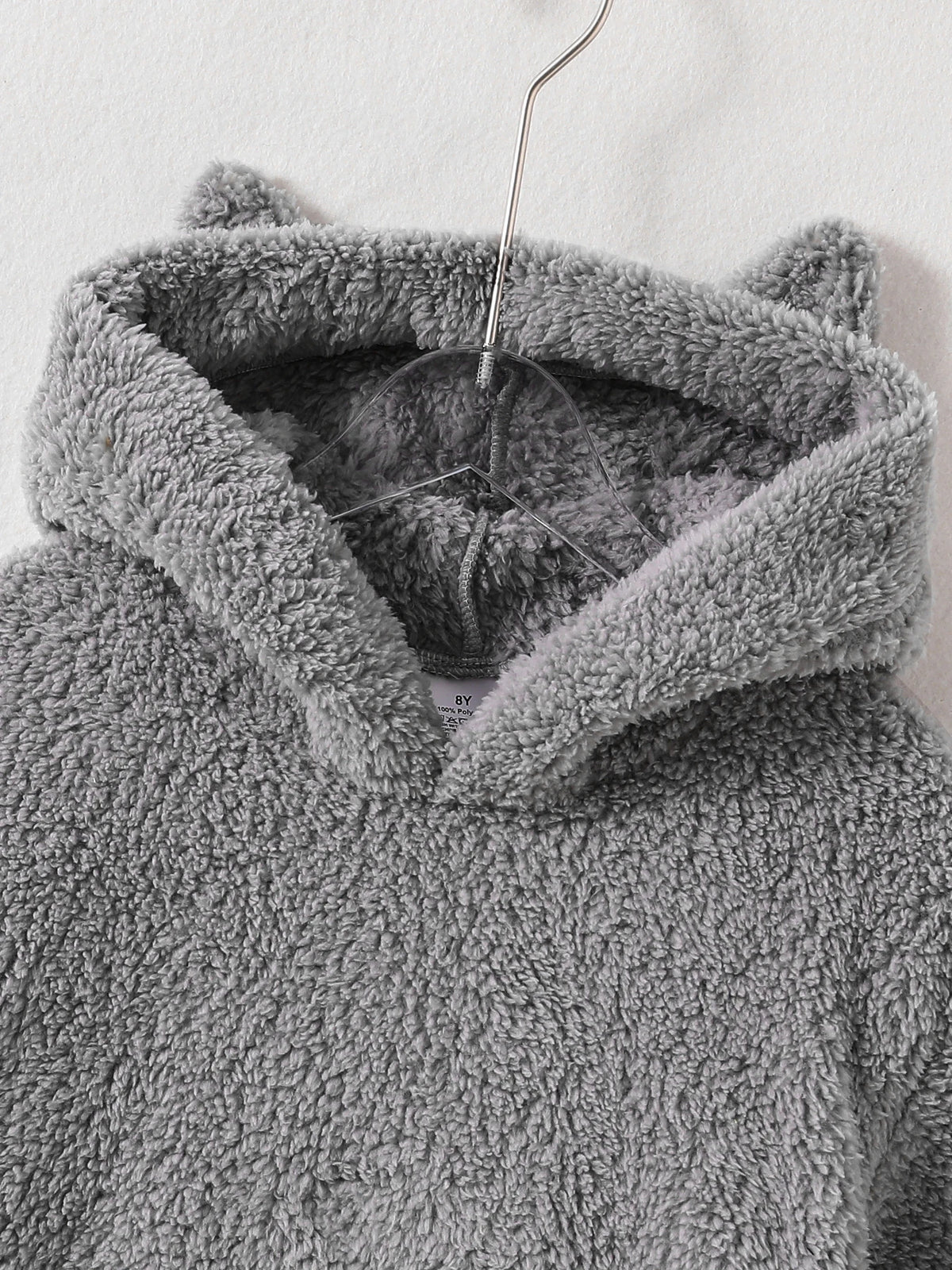Peekaboo Cat Kids Hoodie close-up of the gray cat-ear hood, neckline and fluffy fabric
