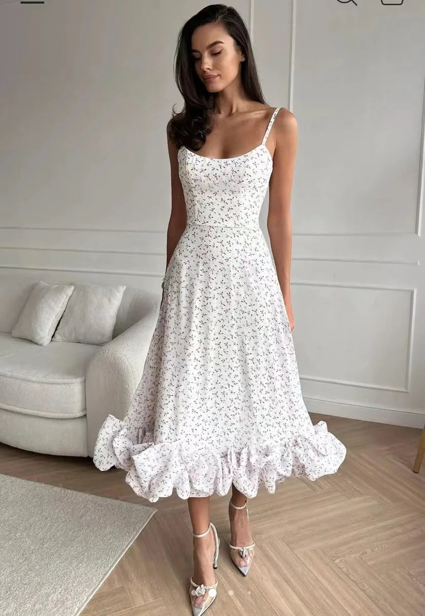 White floral-print version of the ruffle dress shown from the front; gallery style reference