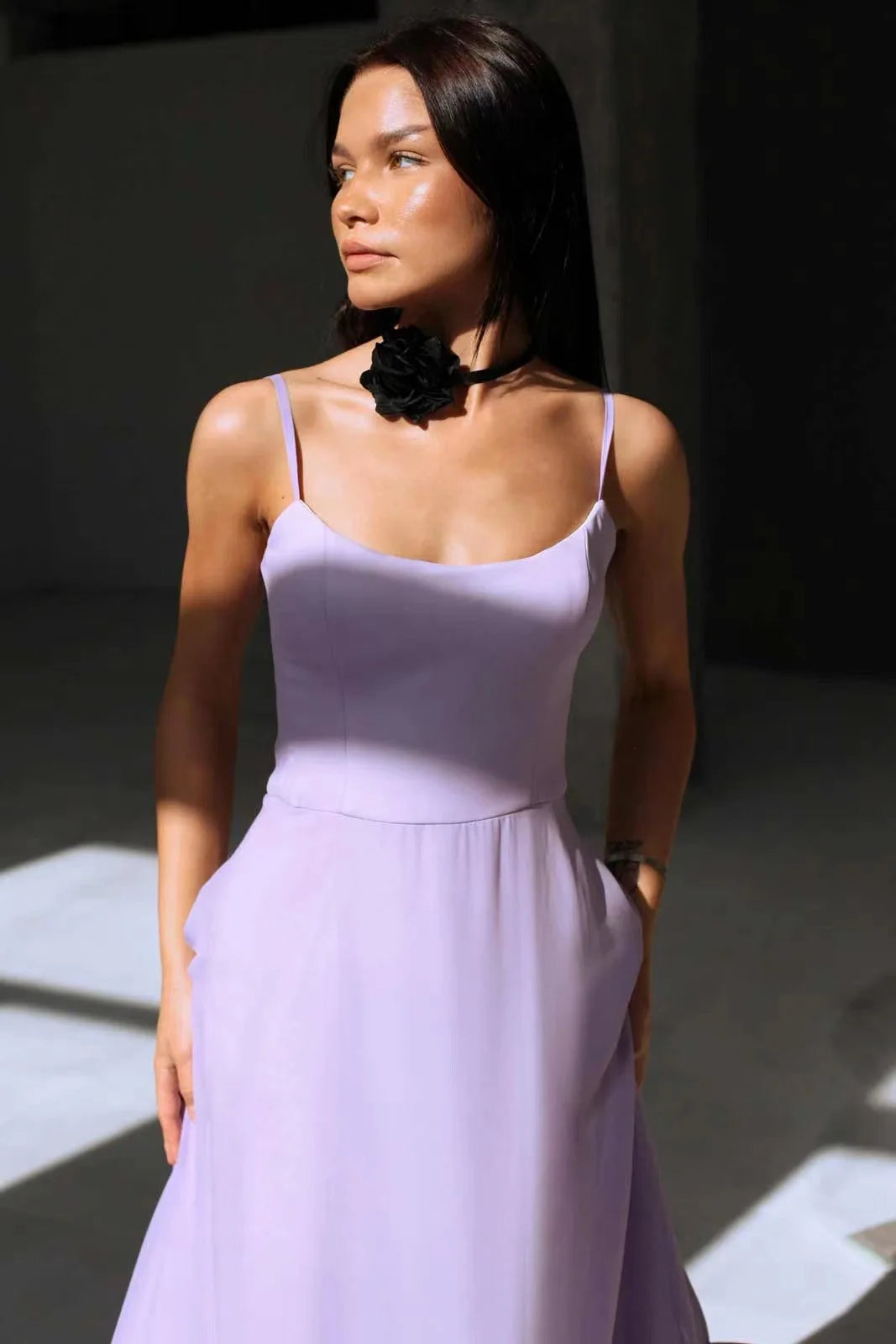Close-up of the purple Petal Waltz Ruffle Dress showing the curved neckline and fitted bodice
