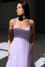 Close-up of the purple Petal Waltz Ruffle Dress showing the curved neckline and fitted bodice