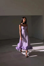 Purple Petal Waltz Ruffle Dress in motion, showing its flared skirt and ruffled hem
