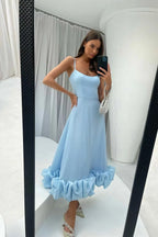 Sky blue Petal Waltz Ruffle Dress in a full-length mirror view