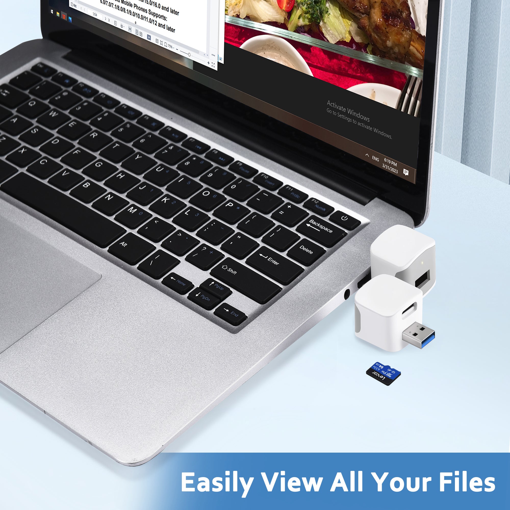 Phone Backup Adapter and microSD card beside a laptop displaying backed-up photo files
