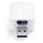 Phone Backup Adapter front view showing the white cube, USB-A plug, and inserted microSD card