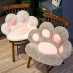 Plush Cat Paw Cushion white and gray color variants styled together on wooden chairs