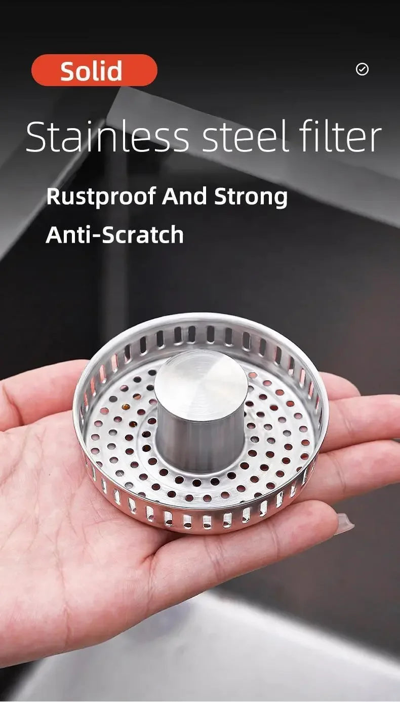 Pop-Up Sink Strainer held in one hand, highlighting the perforated steel basket and center cap.
