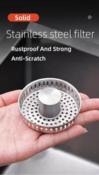 Pop-Up Sink Strainer close-up in hand showing its round perforated basket and push-button stopper.