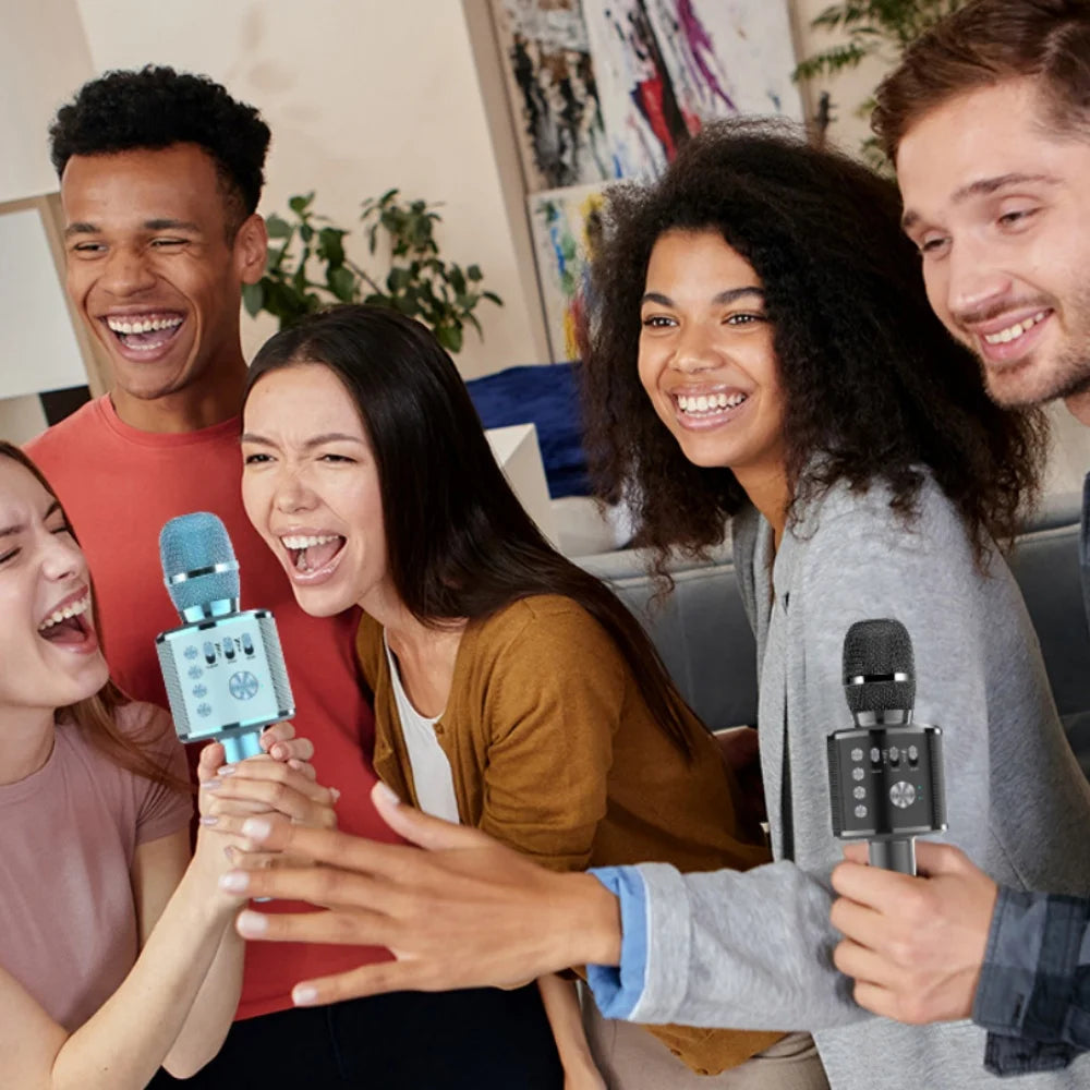 Popstar Karaoke Microphone Blue and Black models held by a group singing together at home