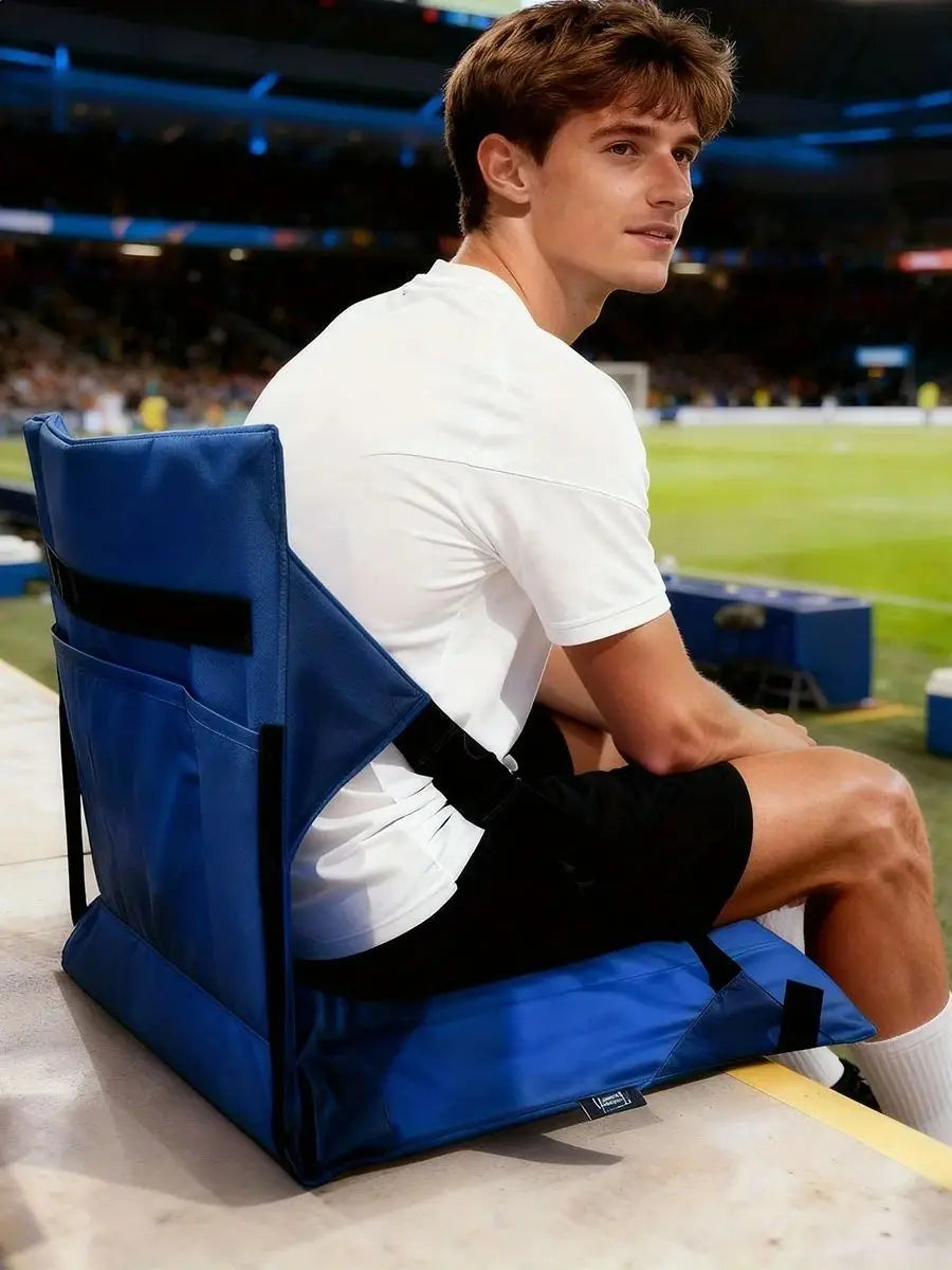 Portable Bleacher Seat portrait view showing the blue backrest, rear pocket, and cushion on stadium bleachers