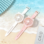 Portable Mini Wrist Fan pink and white fans laid flat to show buckle straps and adjustment holes