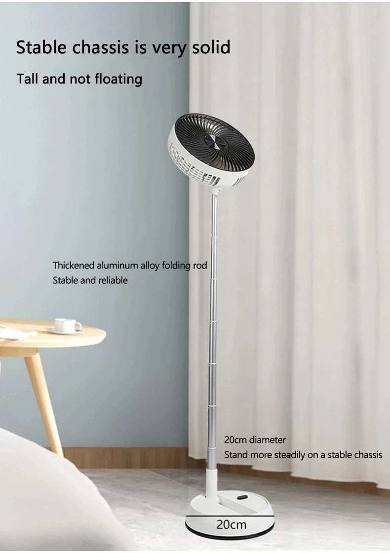 Portable Oscillating Fan standing beside a bed with its stable circular floor base fully visible