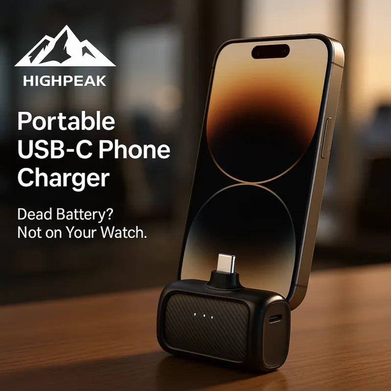 HighPeak Portable USB-C Phone Charger in black fast charging an iPhone on a wooden table with LED background