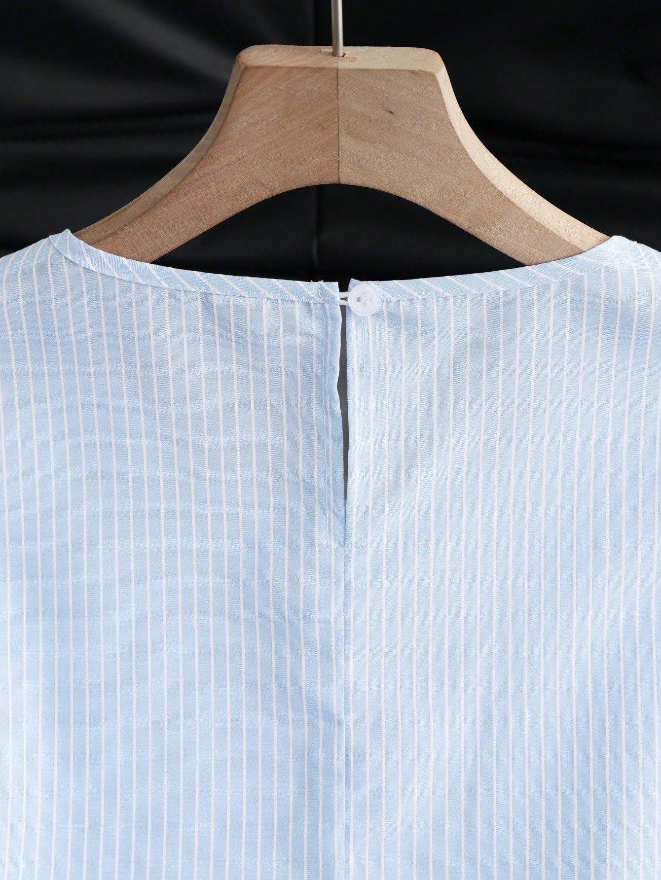 Portofino Ruffle Top back neckline detail showing the keyhole and button closure