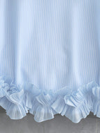Portofino Ruffle Top detail view of the double-layered pleated ruffle hem