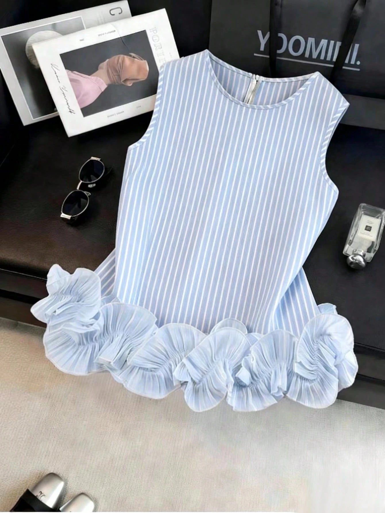 Portofino Ruffle Top front flat lay showing a rounded neckline and dramatic double-layered ruffle trim