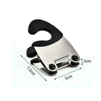 Black pot clip spoon holder with a dimension diagram labeled 7.5 cm by 5 cm by 2 cm