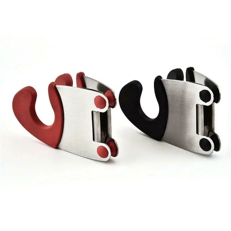 Red and black pot clip spoon holders lying on their sides to show the metal spring clamps