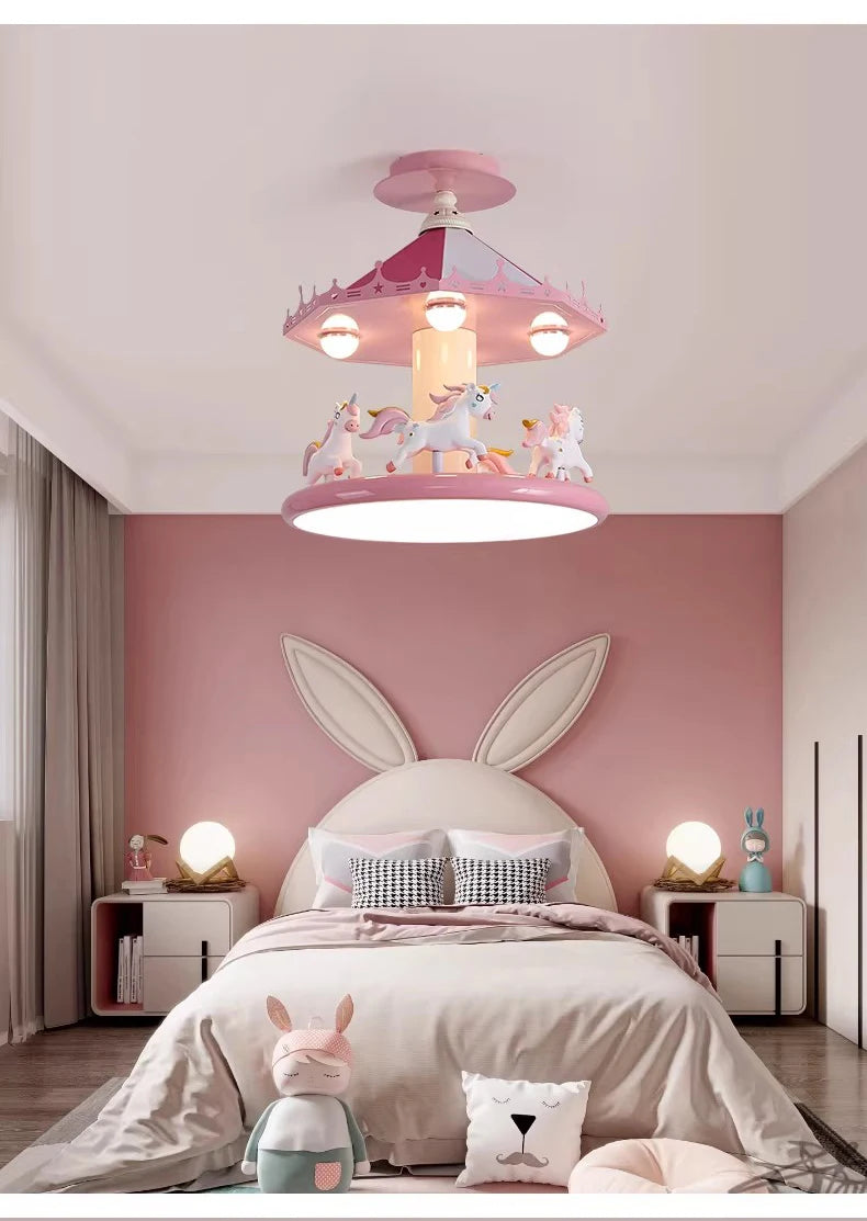 Pink carousel lamp in a bedroom with a bunny-ear headboard and rabbit toy on the floor