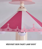 Close-up of the pink striped carousel canopy with crown, star and heart details