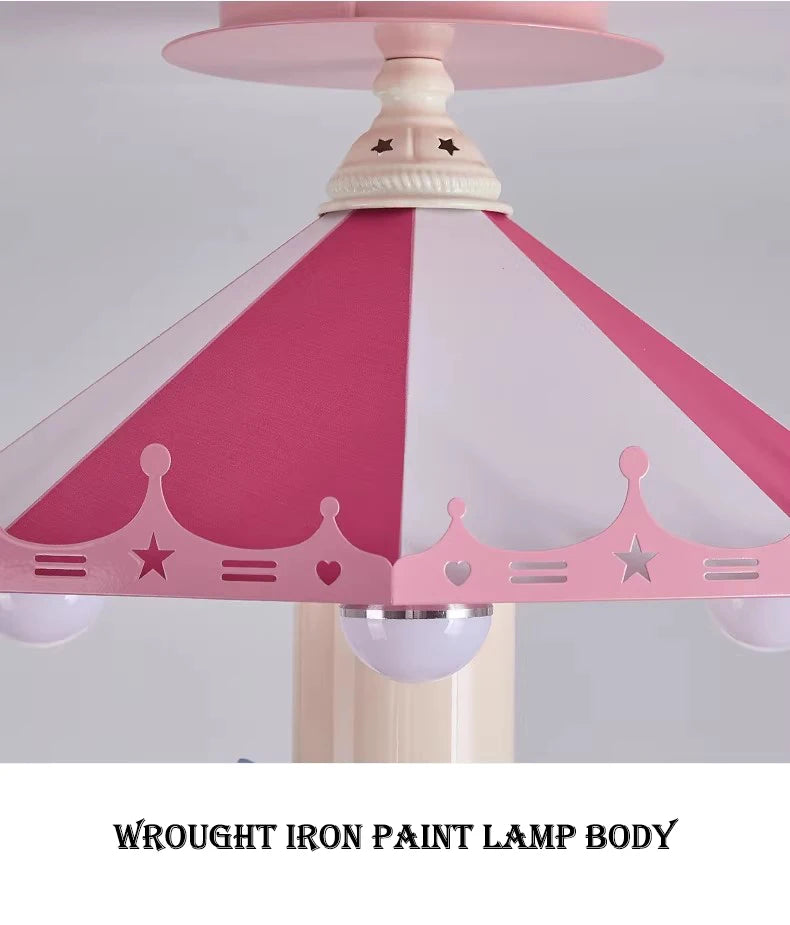 Close-up of the pink striped carousel canopy with crown, star and heart details