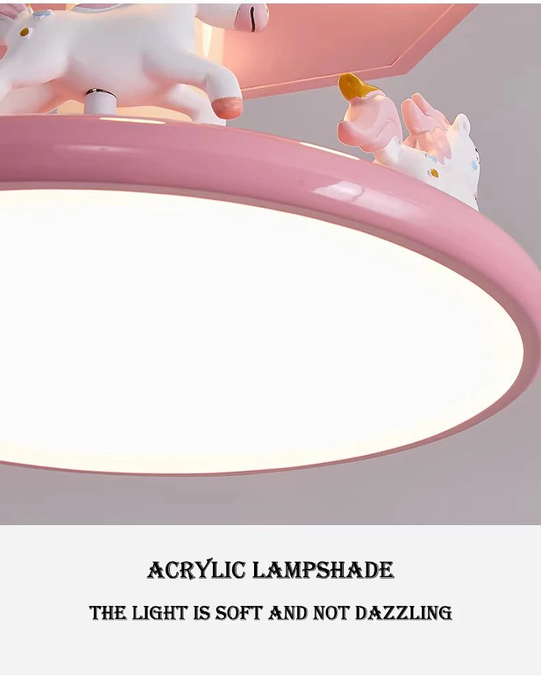 Underside detail of the carousel lamp's acrylic diffuser, pink rim and unicorn figures