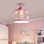 Pink carousel ceiling lamp above a floral bed beside a white wardrobe