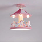 Illuminated pink carousel ceiling lamp with unicorn figures against a gray background
