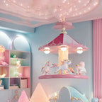 Pink carousel ceiling lamp in a pastel bedroom with a cloud headboard and decorative canopy