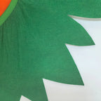 Pumpkin Poncho Costume Set square close-up of the green leaf-shaped collar edge and neckline stitching