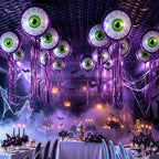 Purple Halloween Eyeball Balloons hanging over banquet tables with skeletons, ghosts, and purple lighting.