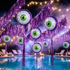 Purple Halloween Eyeball Balloons displayed around a pool with purple fringe garlands and string lights.