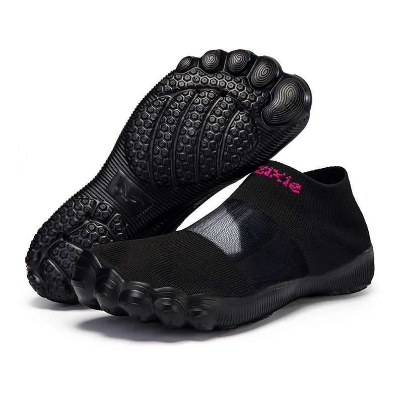Quick-Dry Water Shoes black pair with pink lettering and one textured outsole facing forward.