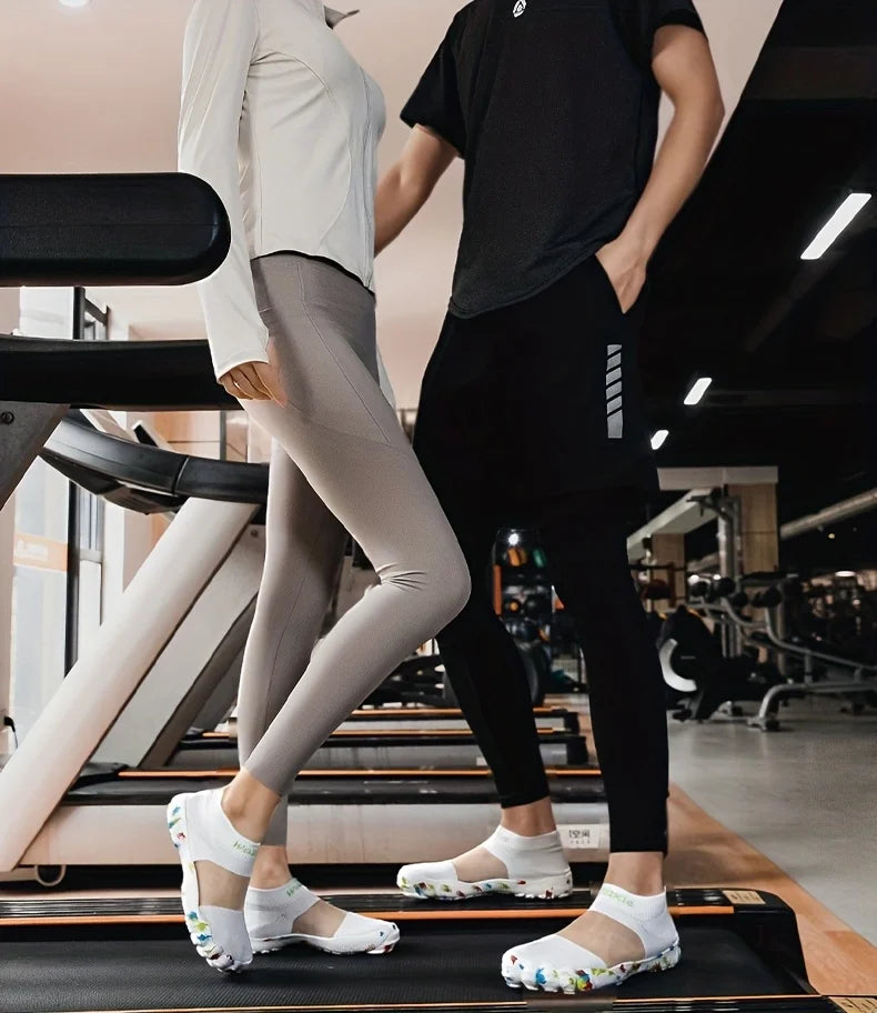 Quick-Dry Water Shoes white pairs worn by two adults standing on treadmills in a gym.