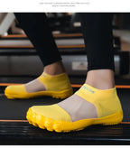 Quick-Dry Water Shoes yellow pair worn on a treadmill with the sheer upper panels visible.