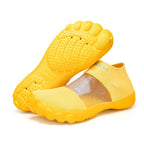 Quick-Dry Water Shoes yellow pair displaying the circular toe tread and textured rubber sole.