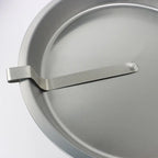 Quick Release Cake Pan close-up showing the stainless steel release strip and folded edge