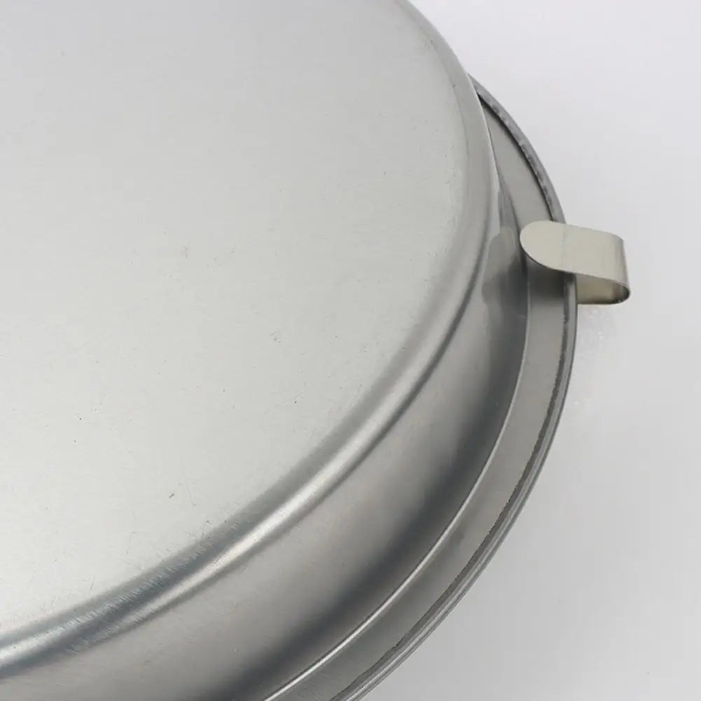 Quick Release Cake Pan underside close-up showing the curved release tab at the rim