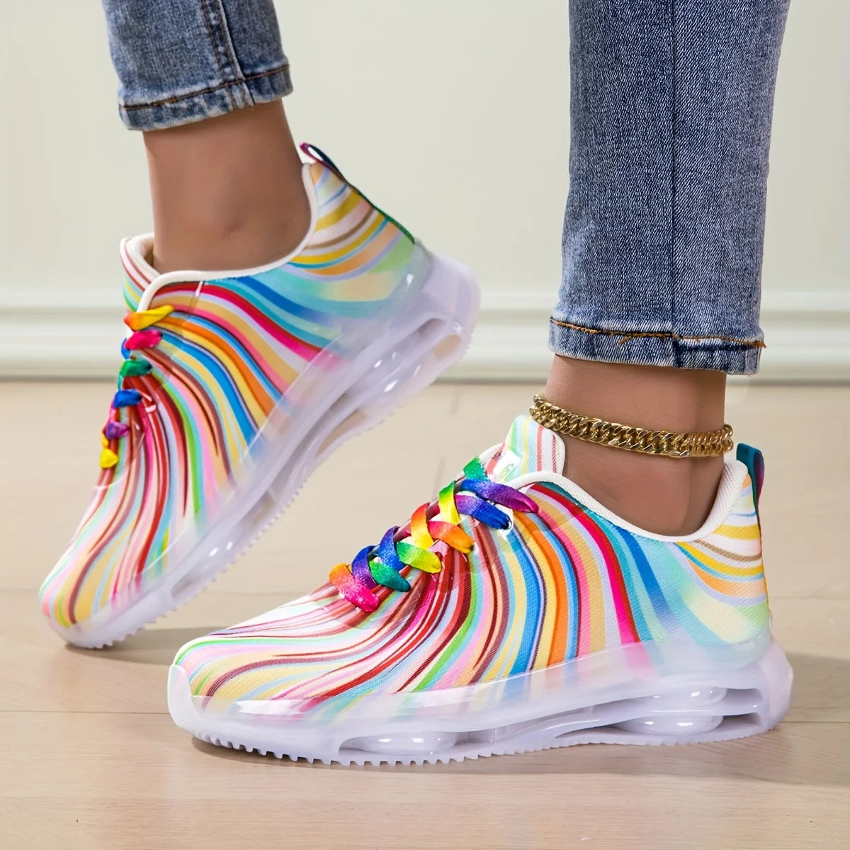 Rainbow Stripe Sneakers in side profile, with curved colorful stripes and sculpted white soles.