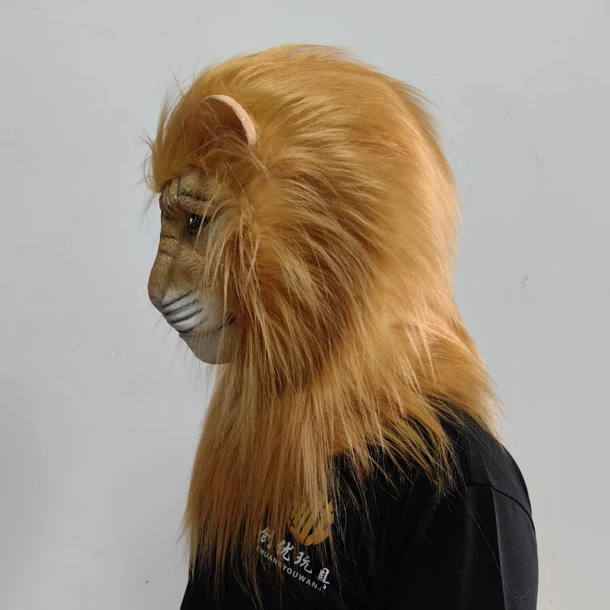 Realistic Deluxe Lion Mask in Light Brown shown in side profile with its long mane covering the neck