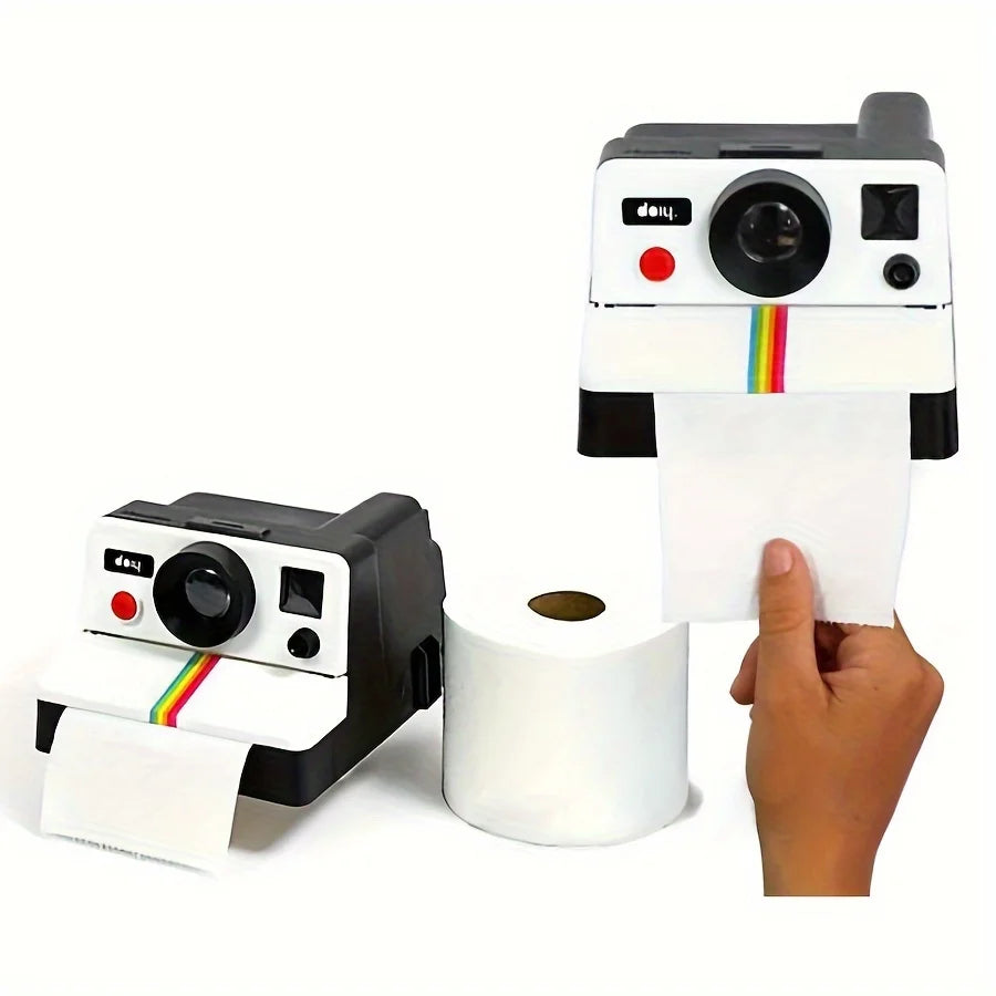 Retro Camera Toilet Paper Holder shown beside a roll with paper dispensing through the front