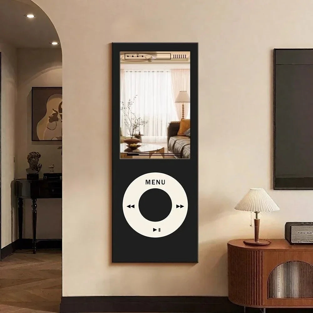Retro MP3 Wall Mirror in black mounted vertically on a cream wall beside a lamp and vintage-style cabinet