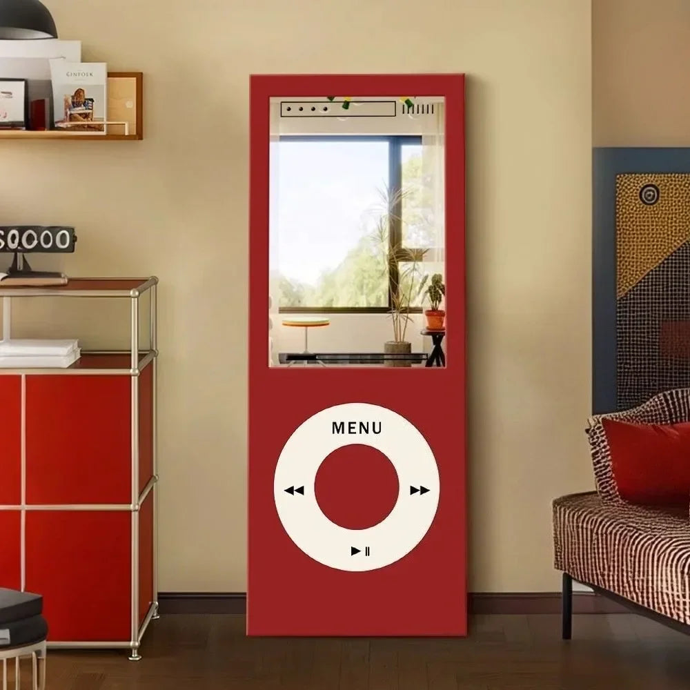 Retro MP3 Wall Mirror in red displayed as a statement piece beside a red cabinet and patterned lounge chair