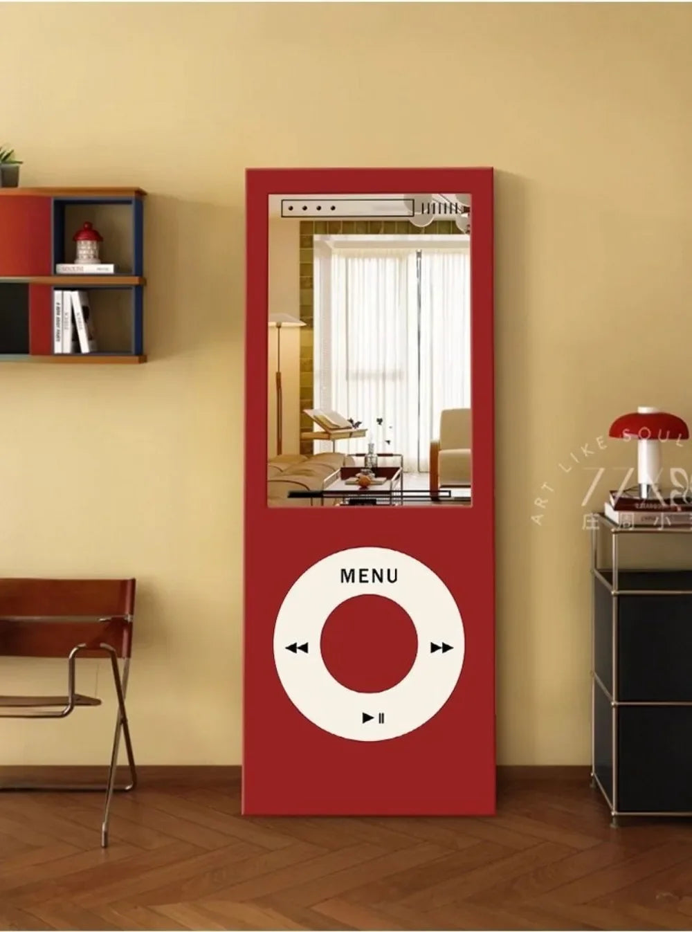 Retro MP3 Wall Mirror in red displayed vertically between a modern wall shelf, chair, and red table lamp