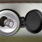 Reusable Soda Can Lid close-up showing its hinge, mounting ring and the open beverage can underneath.