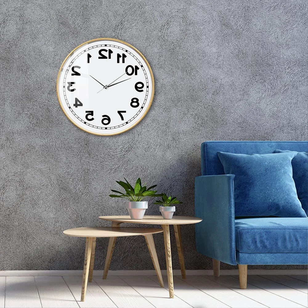 Wooden-frame Reverse Number Wall Clock displayed in a living room with a blue chair