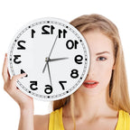 Woman holding the frameless Reverse Number Wall Clock beside her face