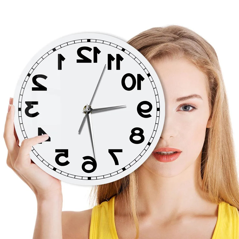 Woman holding the frameless Reverse Number Wall Clock beside her face
