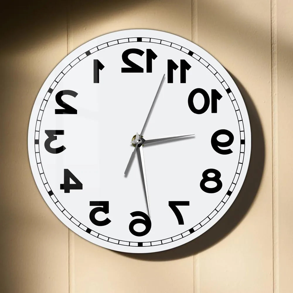 Frameless Reverse Number Wall Clock mounted on a warm neutral wall in direct light