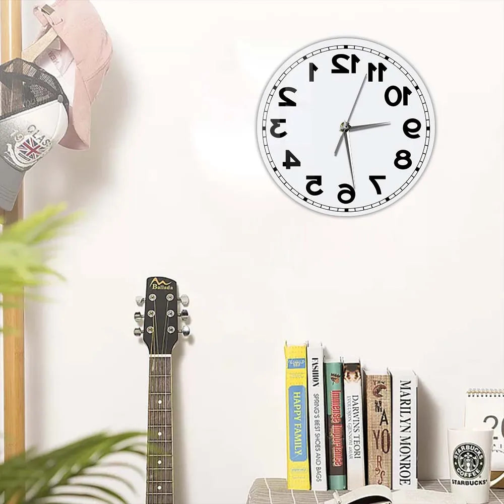 Frameless Reverse Number Wall Clock displayed above a guitar and books