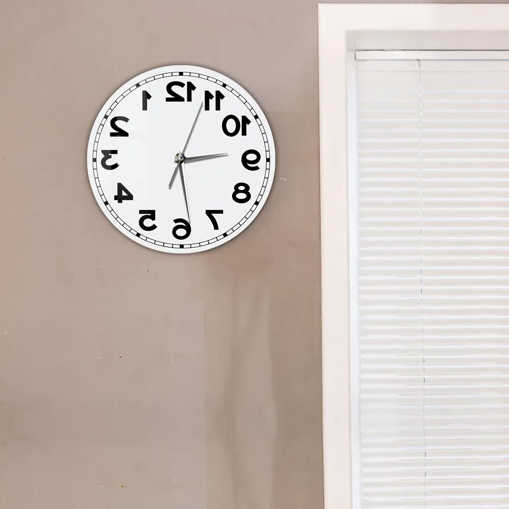 Frameless Reverse Number Wall Clock displayed on a neutral wall beside a window
